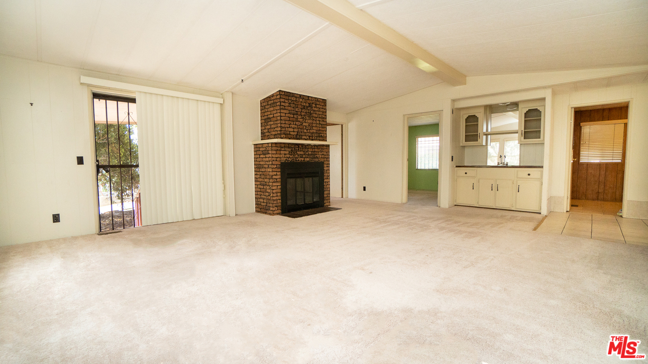 17701 South Avalon Boulevard, Unit 147 Carson, CA 90746 - Photo 3 of 28 an empty room with furniture and a window