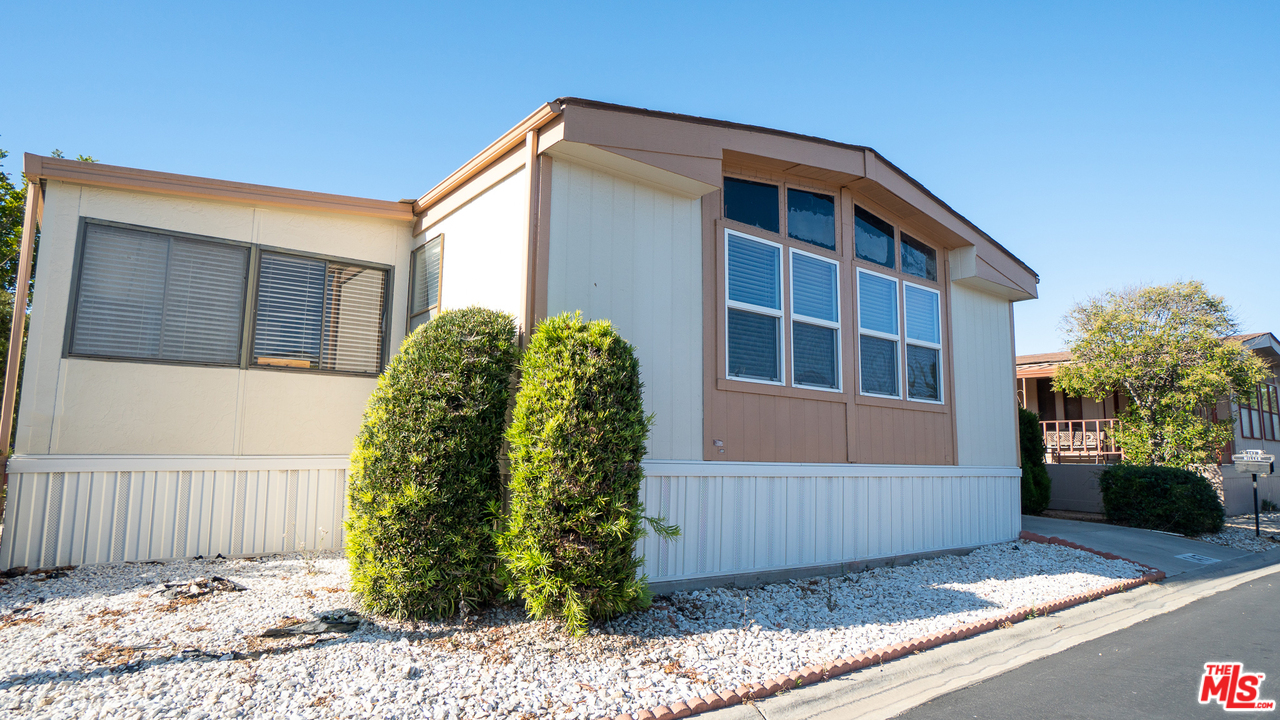 17701 South Avalon Boulevard, Unit 147 Carson, CA 90746 - Photo 28 of 28 a front view of a house with garden