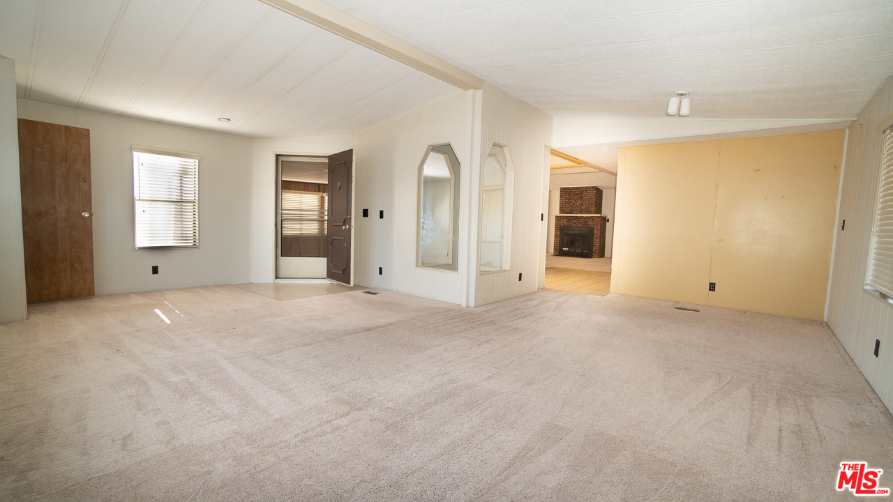 17701 South Avalon Boulevard, Unit 147 Carson, CA 90746 - Photo 9 of 28 a view of an empty room with window and cabinet