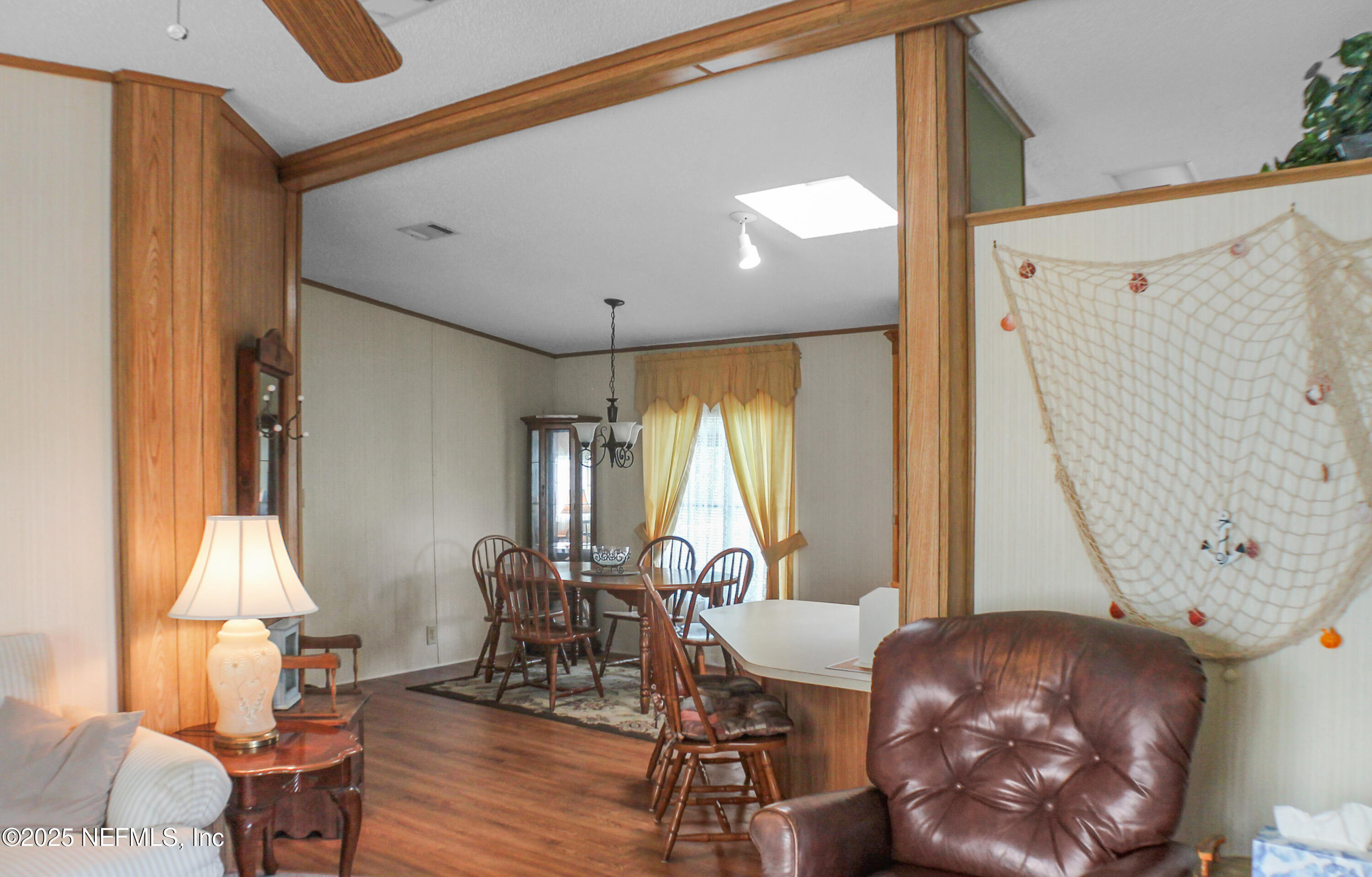 134 Magnolia Street Satsuma, FL 32189 - Photo 13 of 62 a living room with furniture and a window