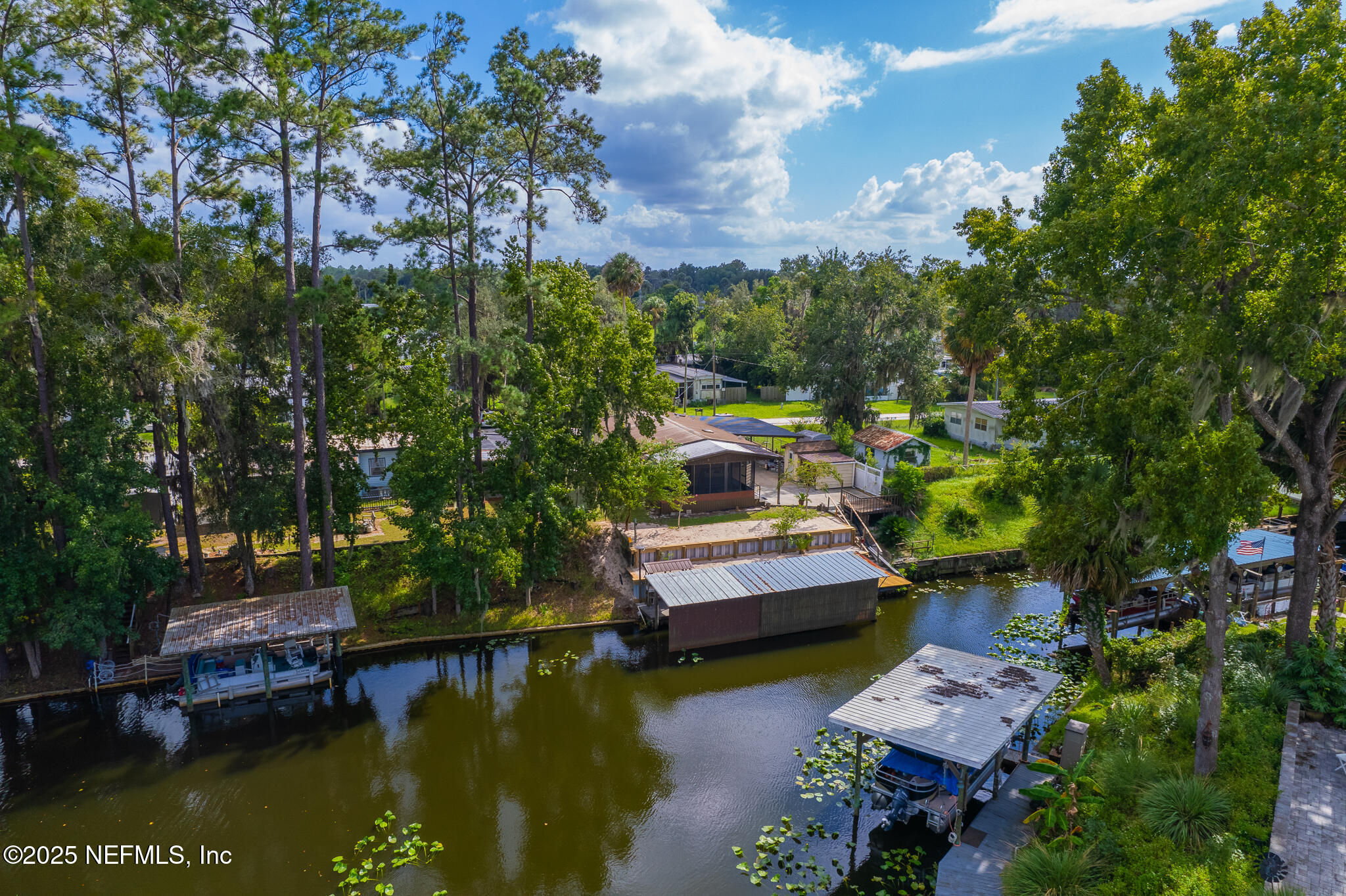 134 Magnolia Street Satsuma, FL 32189 - Photo 2 of 62 a view of house with yard swimming pool and outdoor seating