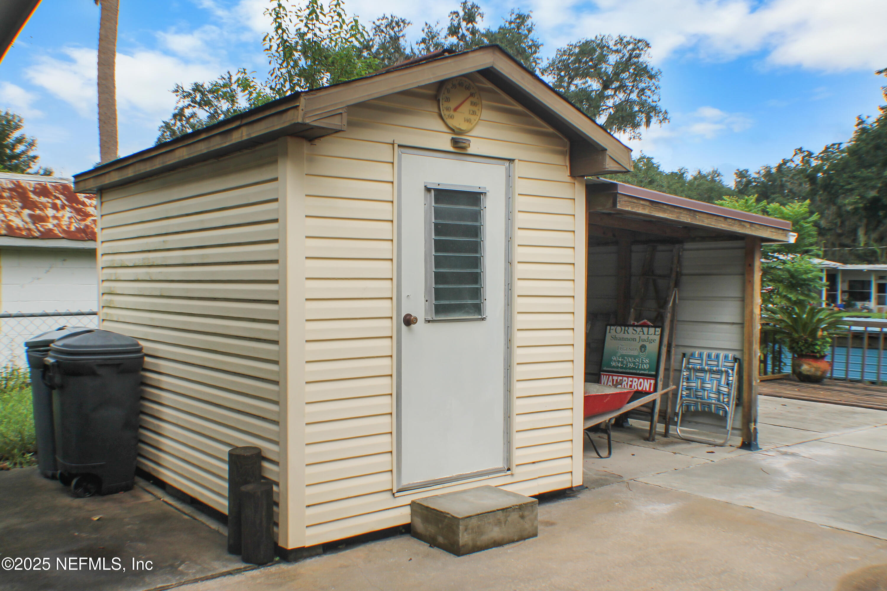 134 Magnolia Street Satsuma, FL 32189 - Photo 24 of 62 a view of a house with a yard and a garage
