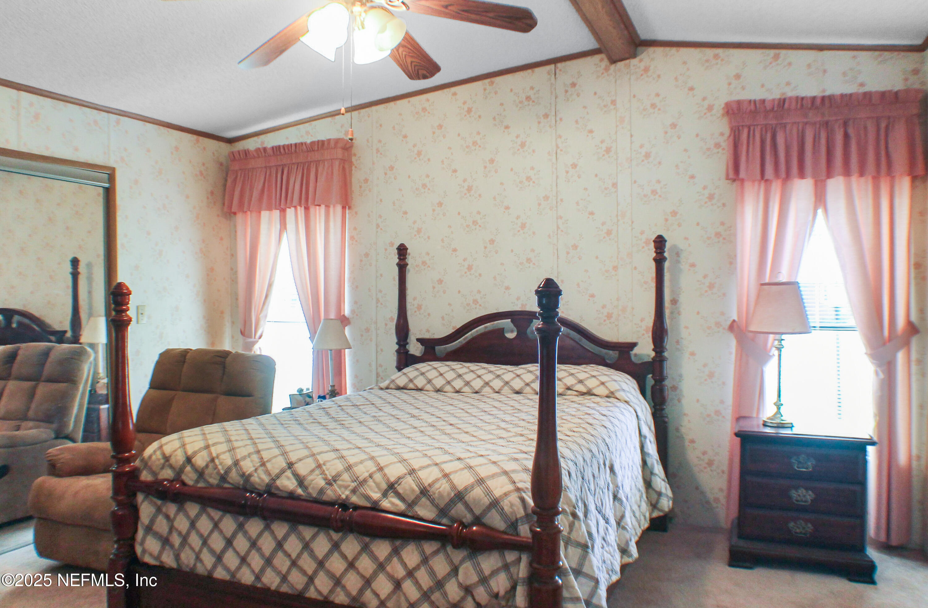 134 Magnolia Street Satsuma, FL 32189 - Photo 25 of 62 a bedroom with a bed and a dresser