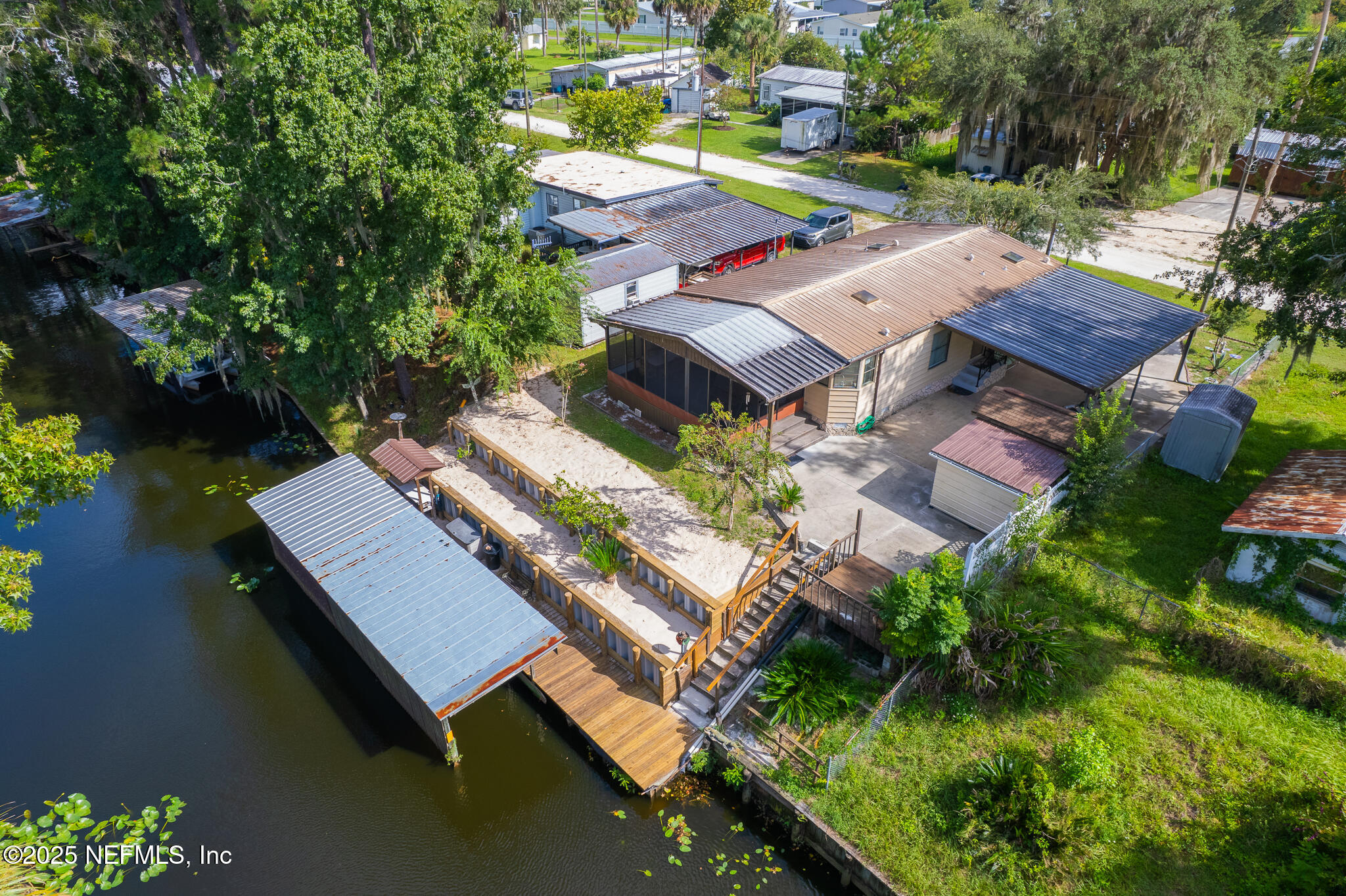 134 Magnolia Street Satsuma, FL 32189 - Photo 3 of 62 an aerial view of a house with outdoor space and lake view