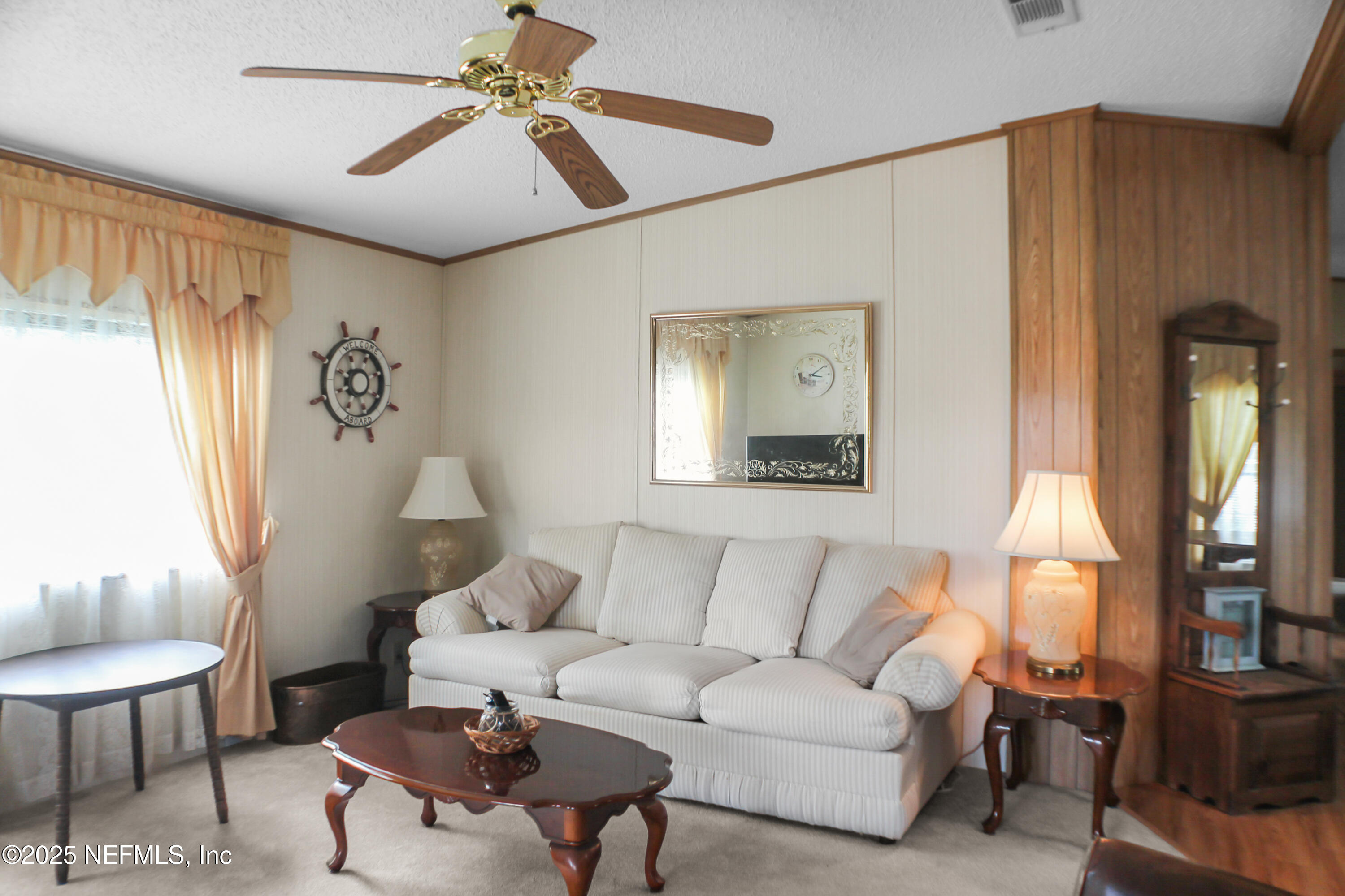 134 Magnolia Street Satsuma, FL 32189 - Photo 4 of 62 a living room with furniture and a large window