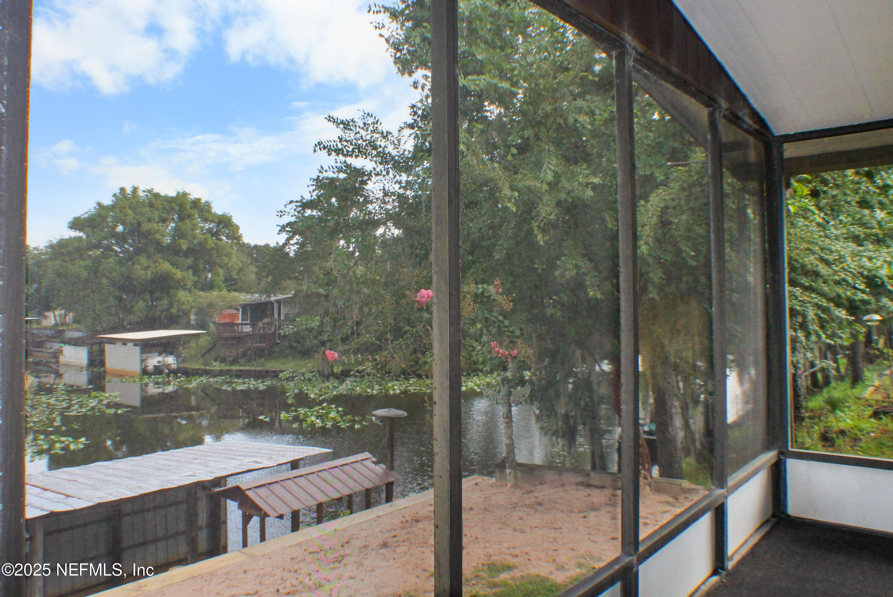 134 Magnolia Street Satsuma, FL 32189 - Photo 41 of 62 a view of a glass door and porch