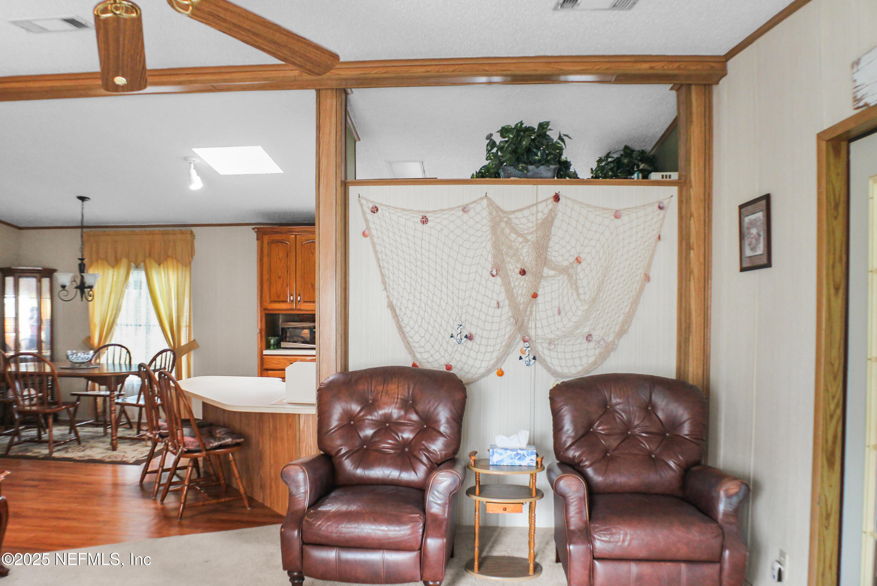 134 Magnolia Street Satsuma, FL 32189 - Photo 5 of 62 a living room with furniture and a large window