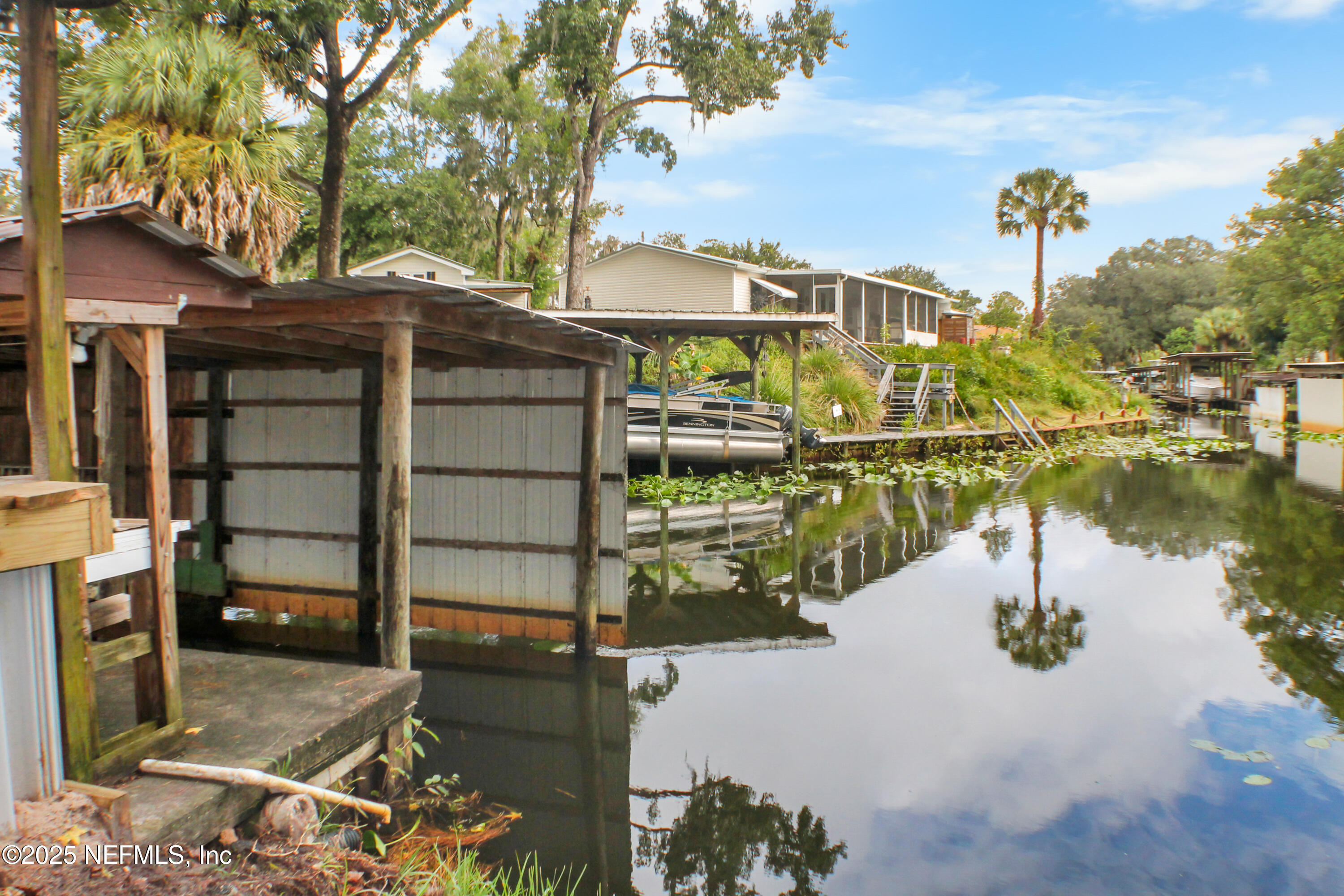 134 Magnolia Street Satsuma, FL 32189 - Photo 54 of 62 a view of a lake with a house