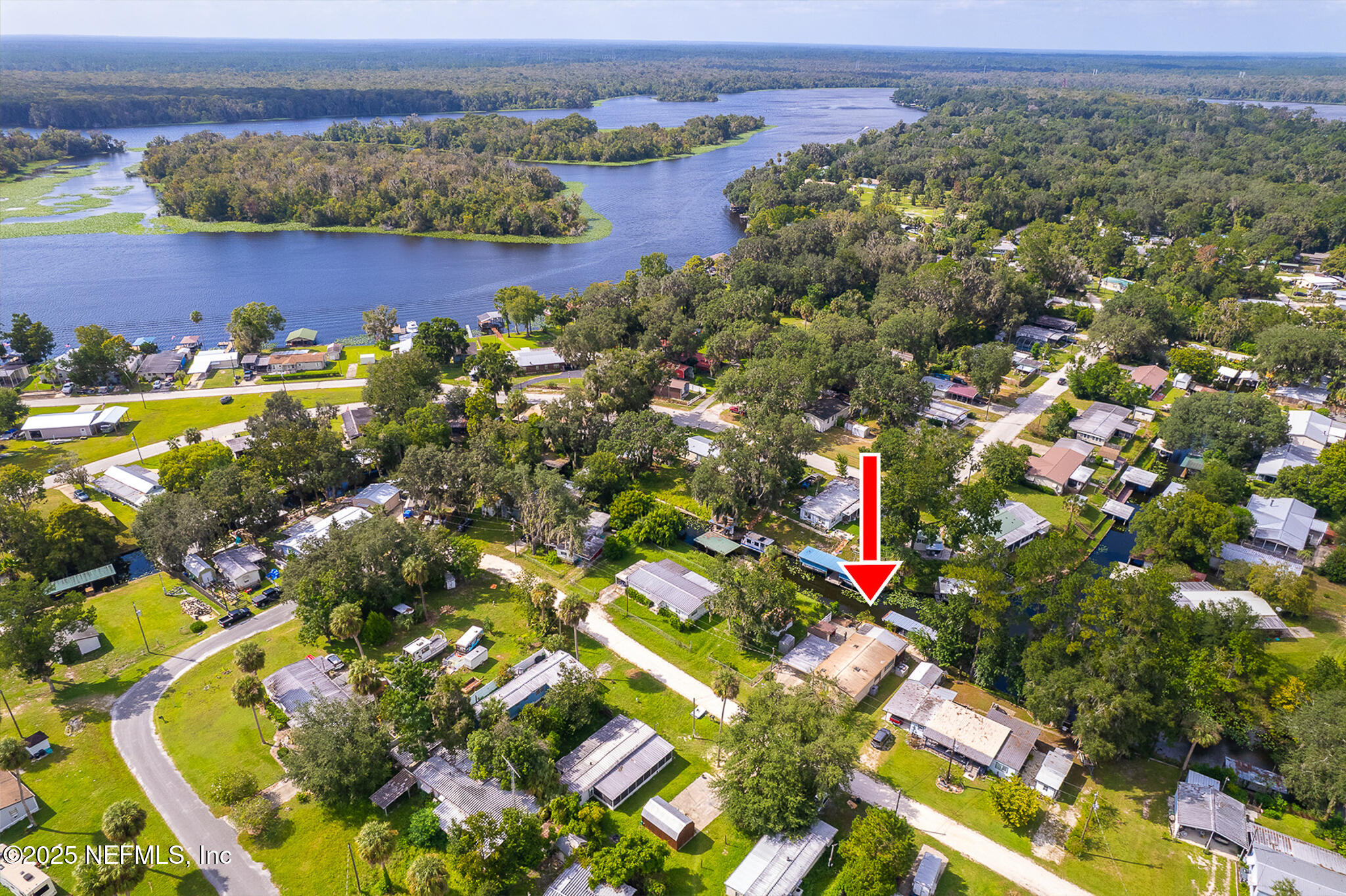 134 Magnolia Street Satsuma, FL 32189 - Photo 61 of 62 an aerial view of a houses with a lake and mountain view
