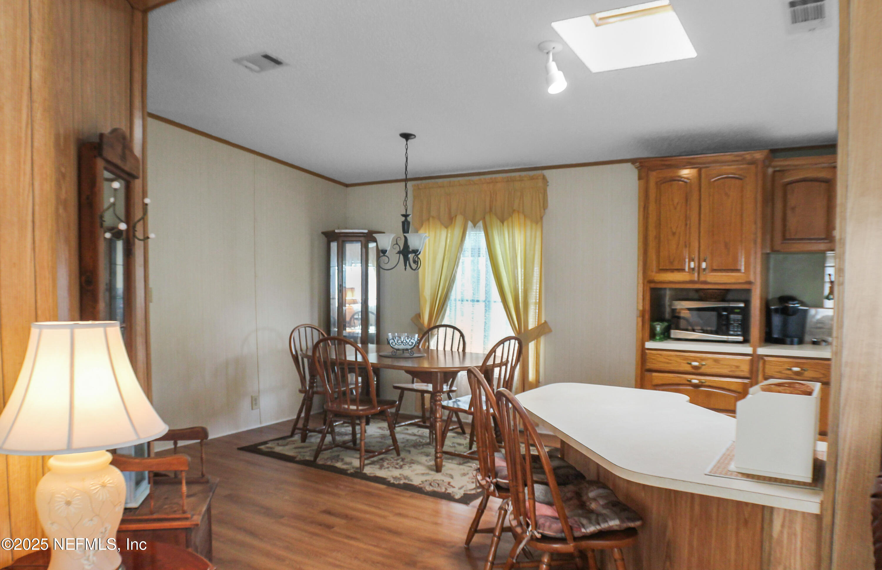 134 Magnolia Street Satsuma, FL 32189 - Photo 8 of 62 a view of a dining room with furniture window and wooden floor