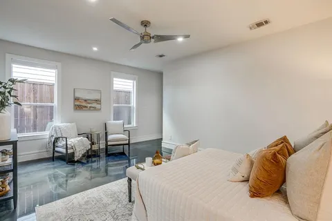 a bedroom with bed room and couch