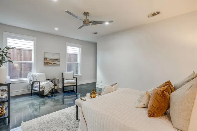 a bedroom with bed room and couch