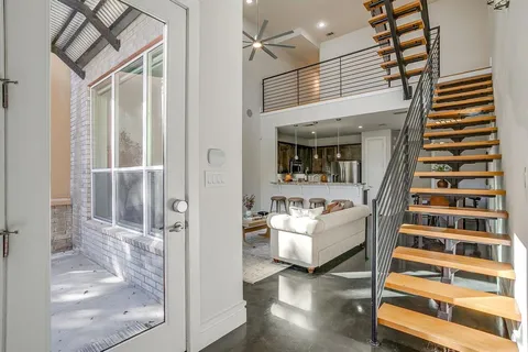 a view of living room with furniture and window