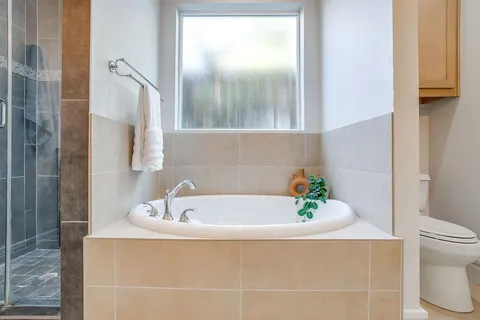 a bathroom with a bathtub a sink and a toilet