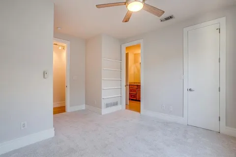 a view of an empty room with a bathroom