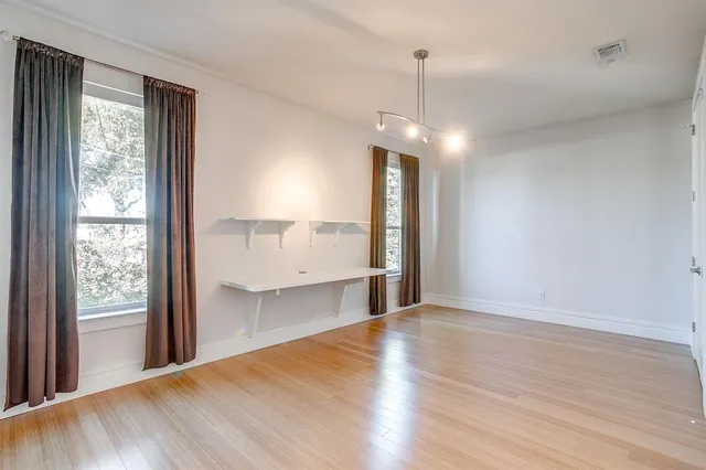 a view of a kitchen with a sink and dishwasher wooden floor