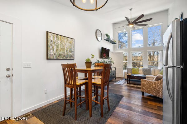 667 Turkey Nest Road Gatlinburg, TN 37738 - Photo 11 of 29 a dining room with furniture a floor to ceiling window and wooden floor