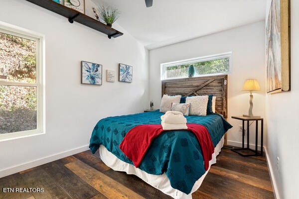 667 Turkey Nest Road Gatlinburg, TN 37738 - Photo 14 of 29 a bed sitting in a bedroom next to a window