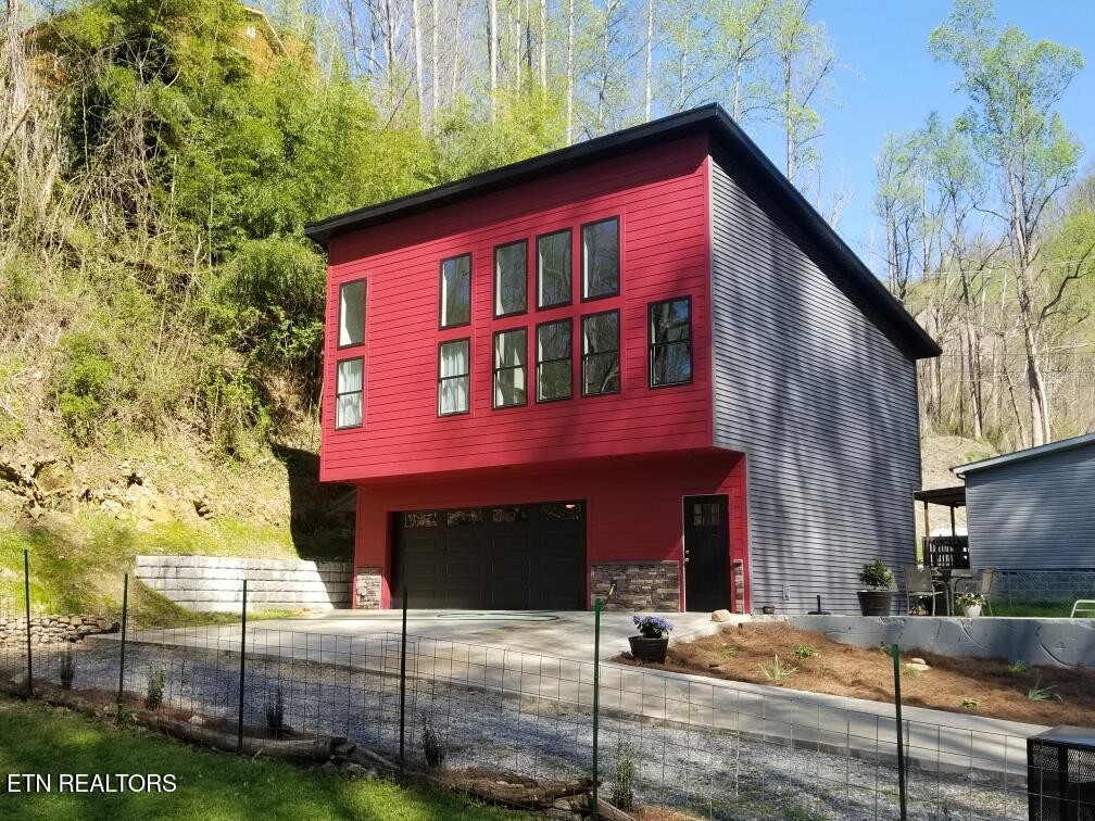 667 Turkey Nest Road Gatlinburg, TN 37738 - Photo 5 of 29 a front view of a house with garage