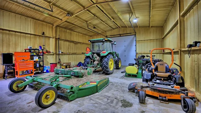 a room with water heater and wooden cabinets