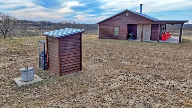 a view of a backyard and a ocean view