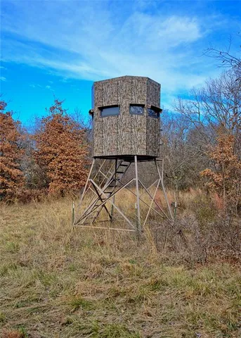a view of a chair and table in the patio