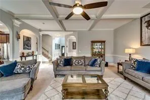 a kitchen with stainless steel appliances granite countertop a sink a stove and a refrigerator