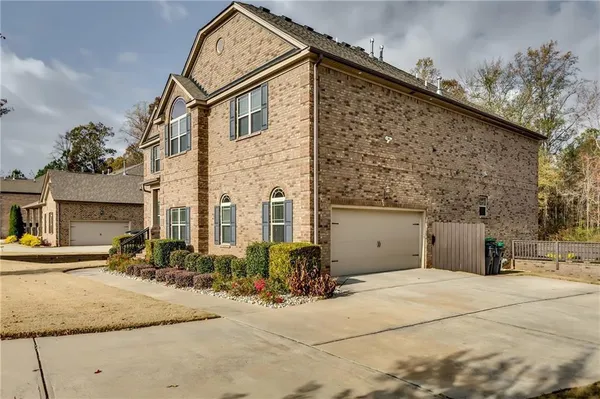 a front view of a house with yard