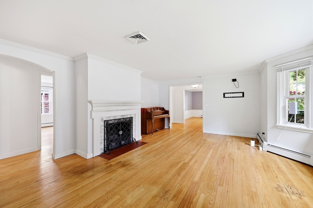 130 Connecticut Avenue Springfield, MA 01107 - Photo 27 of 40 a view of empty room with wooden floor and fireplace