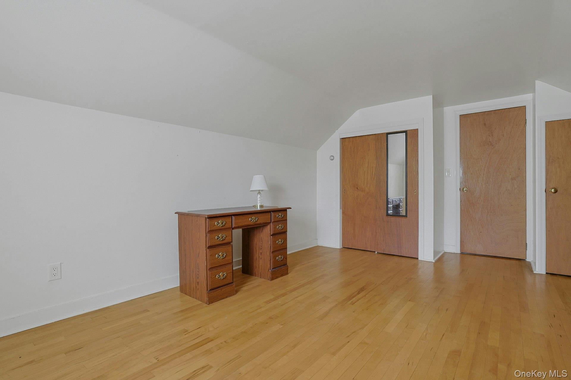 31 Townline Road Pearl River, NY 10965 - Photo 19 of 27 a view of an empty room with wooden floor and closet