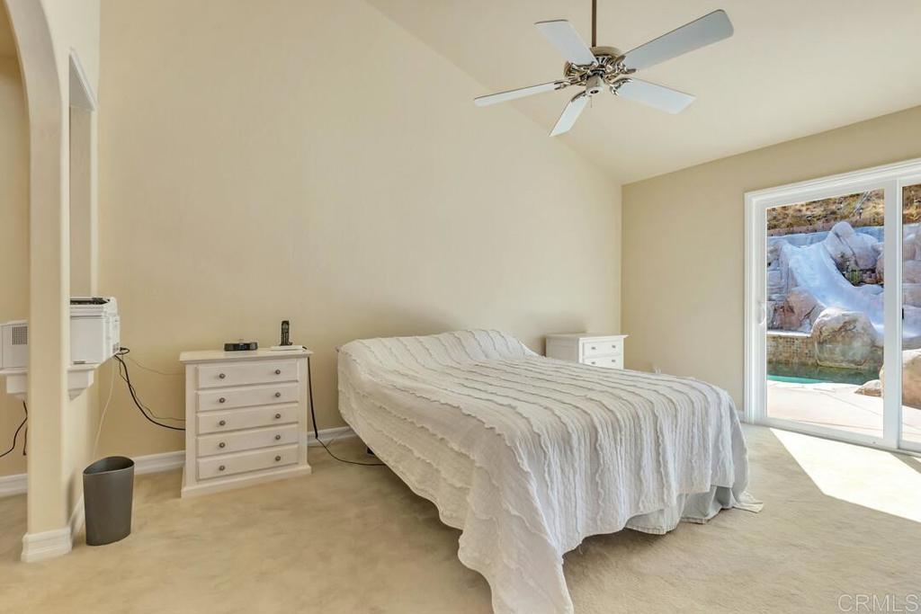10447 Cadwell Road Santee, CA 92071 - Photo 13 of 32 a bedroom with a bed and a cabinets