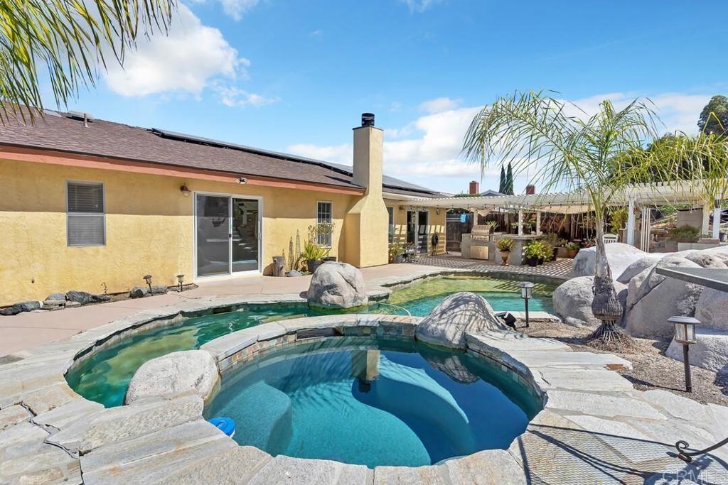 10447 Cadwell Road Santee, CA 92071 - Photo 24 of 32 a view of a house with swimming pool and porch