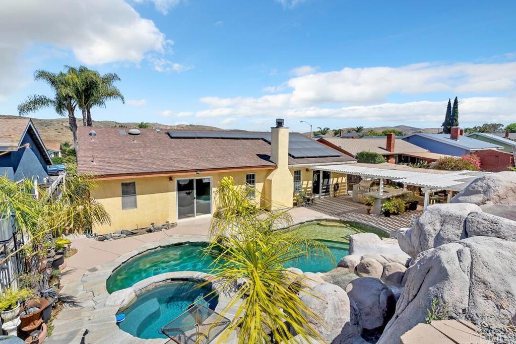 10447 Cadwell Road Santee, CA 92071 - Photo 26 of 32 a front view of a house with a garden and lake view