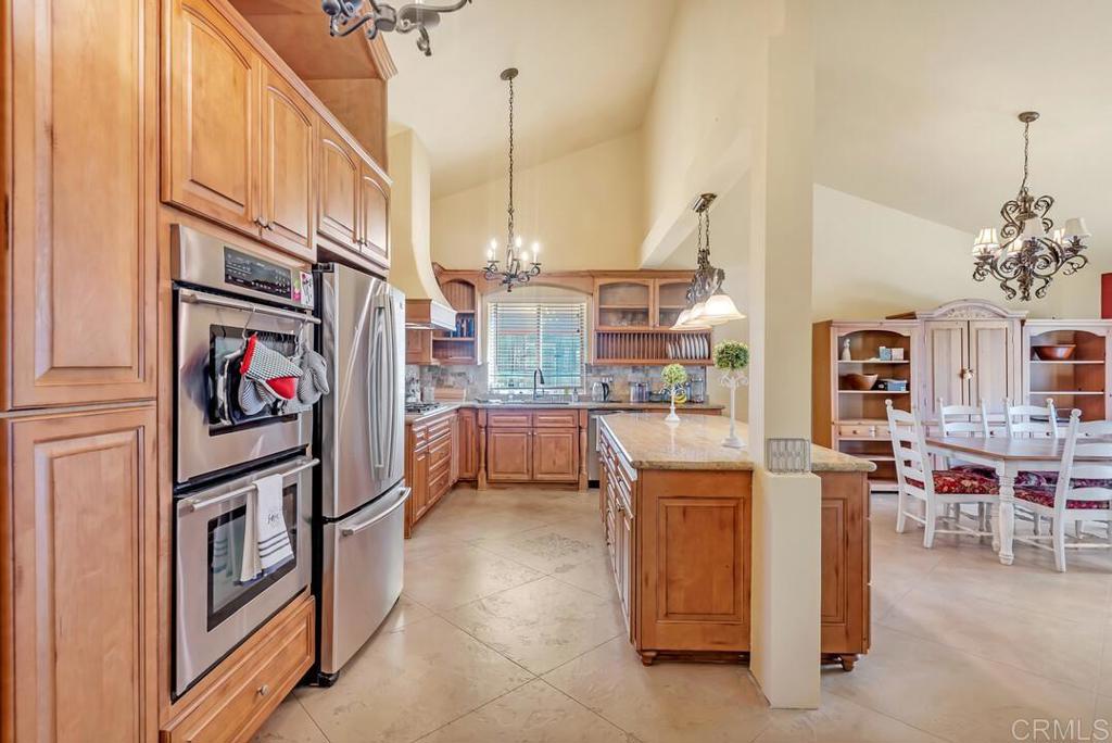 10447 Cadwell Road Santee, CA 92071 - Photo 5 of 32 a kitchen with cabinets and furniture