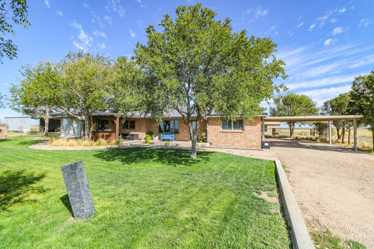 311 County Road 74 Muleshoe, TX 79347 - Photo 22 of 39 a front view of a house with a garden