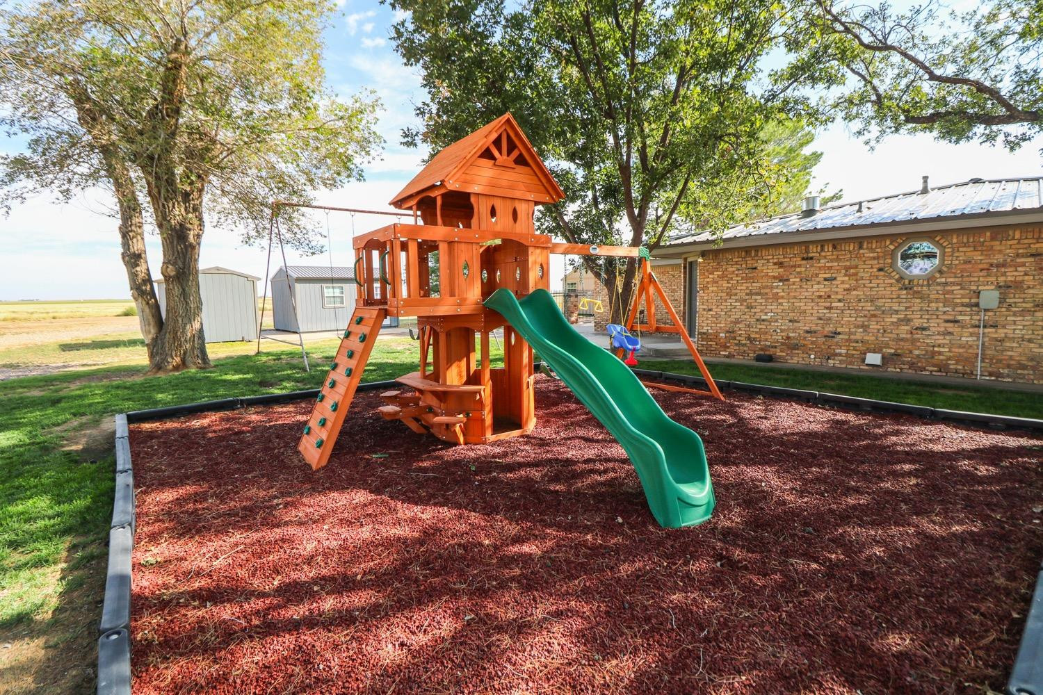 311 County Road 74 Muleshoe, TX 79347 - Photo 27 of 39 a view of outdoor space with a slide