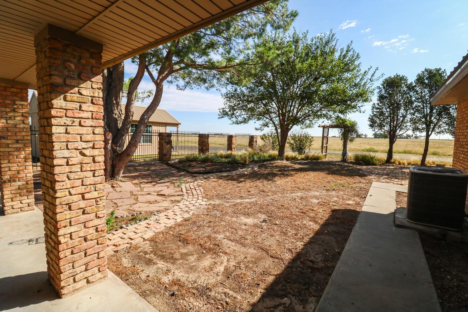 311 County Road 74 Muleshoe, TX 79347 - Photo 29 of 39 a view of a pathway with a yard