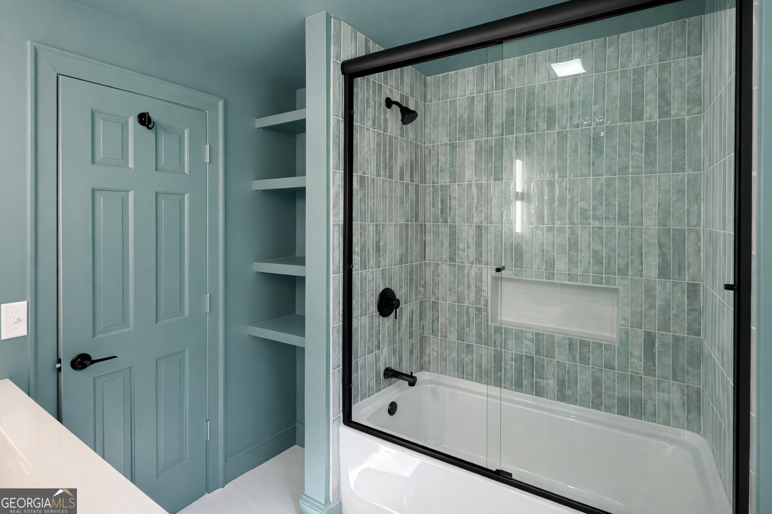3045 Hitt Road Cumming, GA 30041 - Photo 22 of 46 a bathroom with a bathtub and a shower
