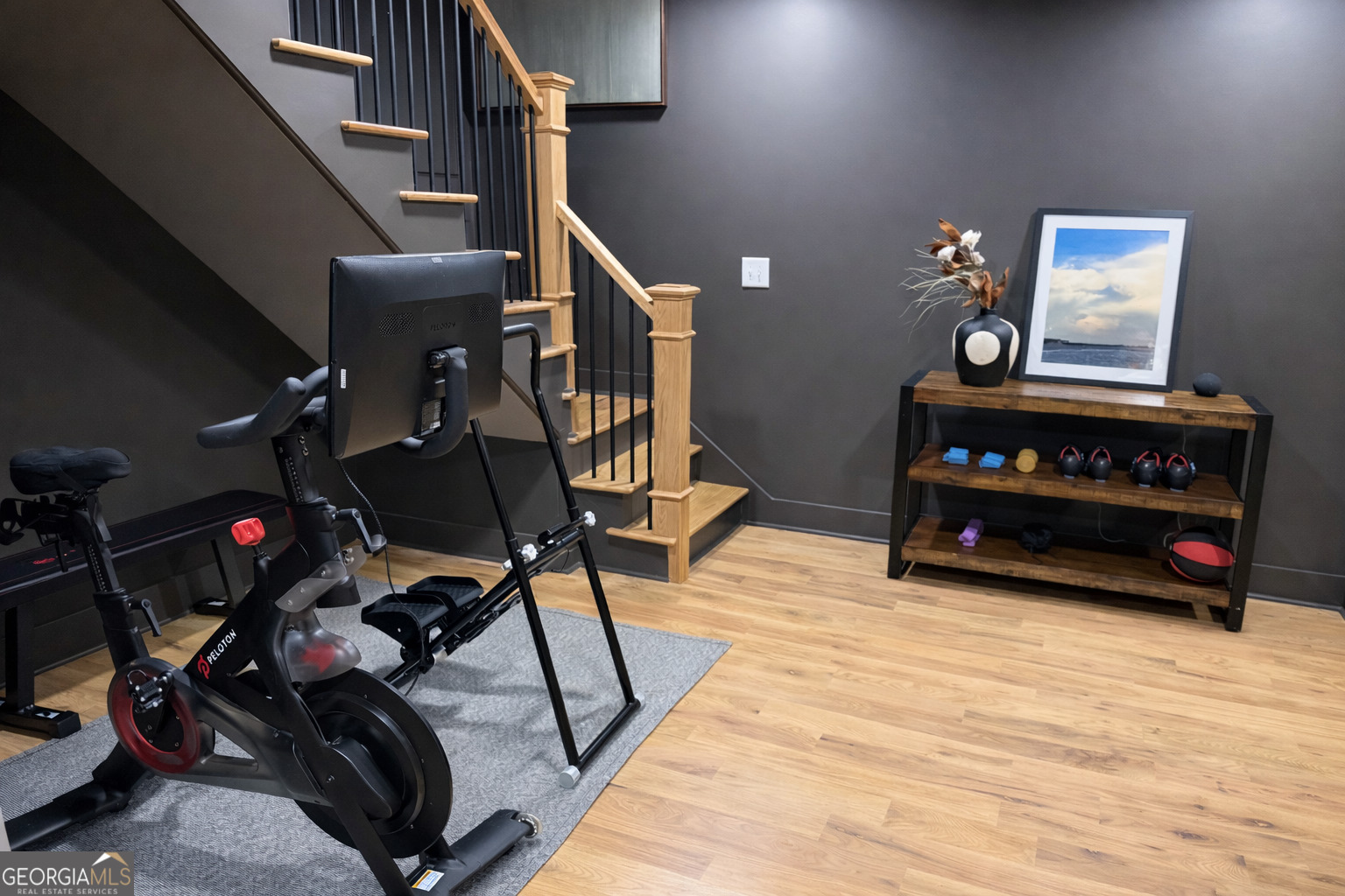 3045 Hitt Road Cumming, GA 30041 - Photo 31 of 46 a bedroom with furniture and a wooden floor