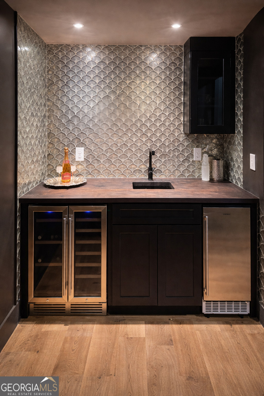 3045 Hitt Road Cumming, GA 30041 - Photo 34 of 46 a bathroom with a sink and a mirror