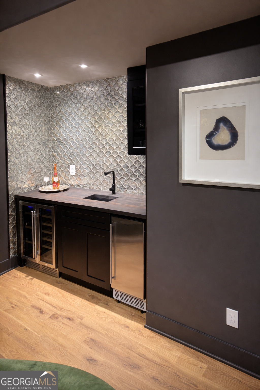 3045 Hitt Road Cumming, GA 30041 - Photo 35 of 46 a bathroom with a sink and a mirror