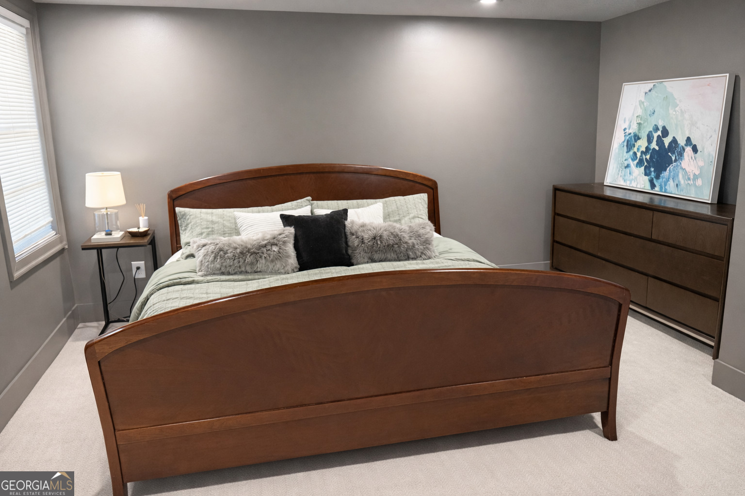 3045 Hitt Road Cumming, GA 30041 - Photo 36 of 46 a bed sitting in a bedroom next to a window