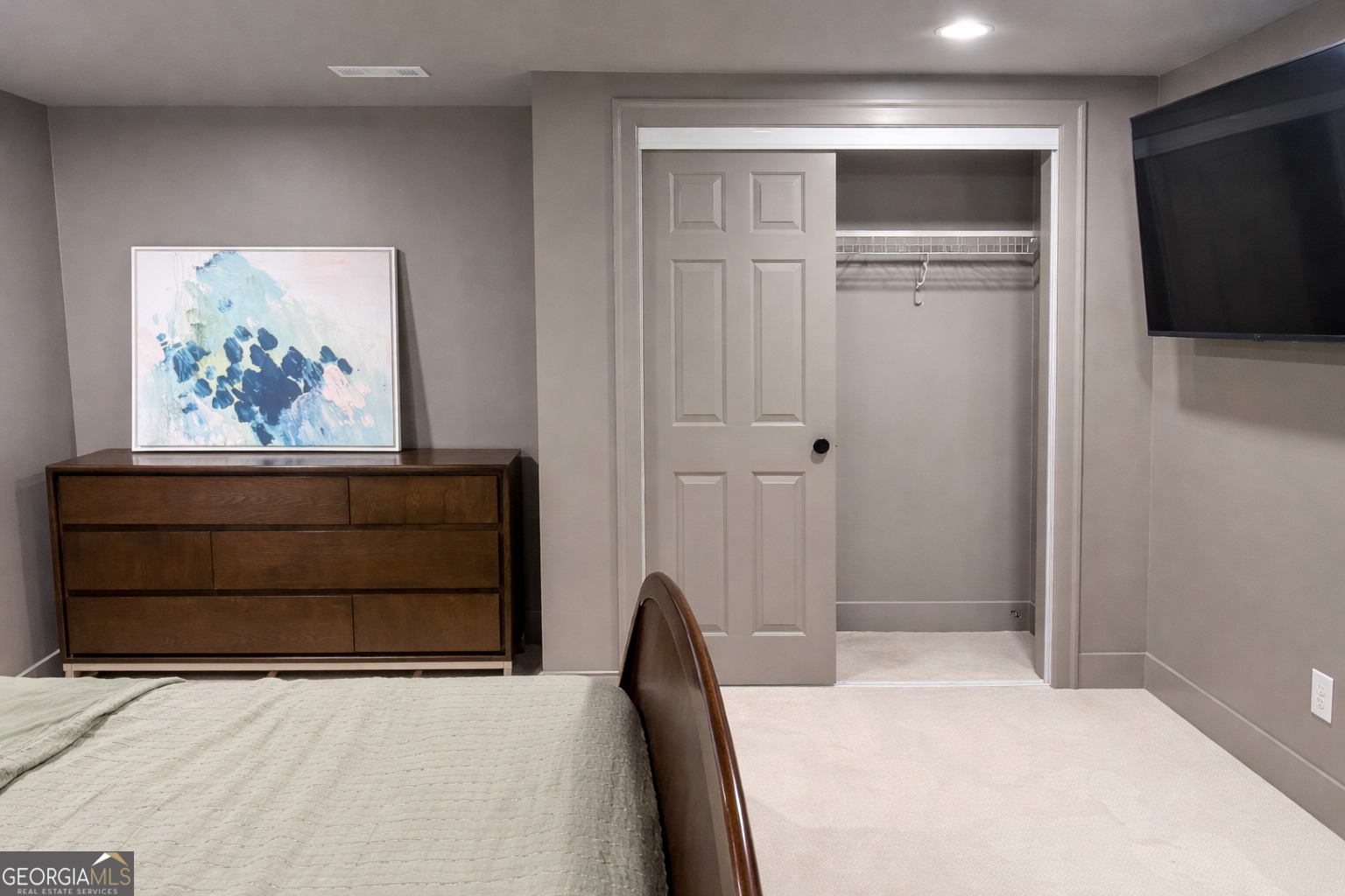 3045 Hitt Road Cumming, GA 30041 - Photo 37 of 46 a bedroom with a bed and a cabinet