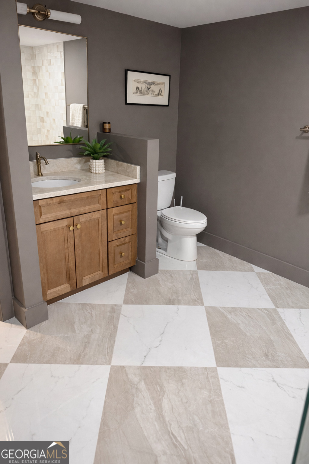 3045 Hitt Road Cumming, GA 30041 - Photo 38 of 46 a bathroom with a granite countertop toilet and a sink