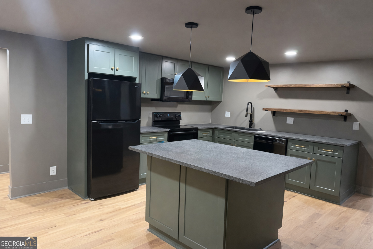 3045 Hitt Road Cumming, GA 30041 - Photo 40 of 46 a kitchen with stainless steel appliances granite countertop a sink a stove a refrigerator and island