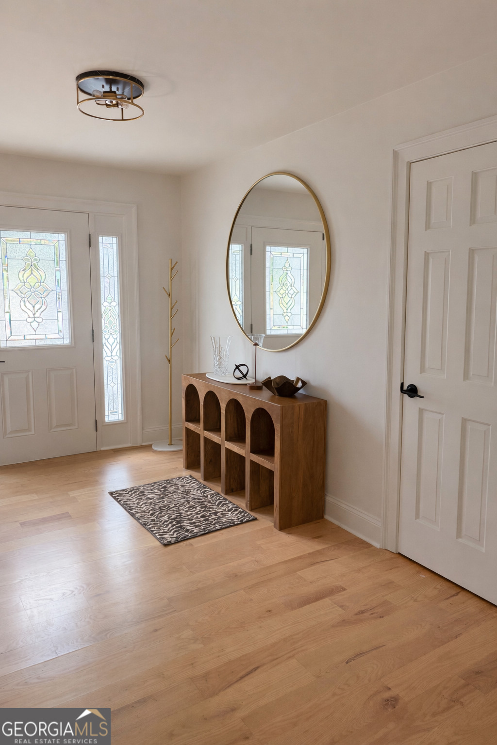 3045 Hitt Road Cumming, GA 30041 - Photo 4 of 46 an empty room with mirror and windows