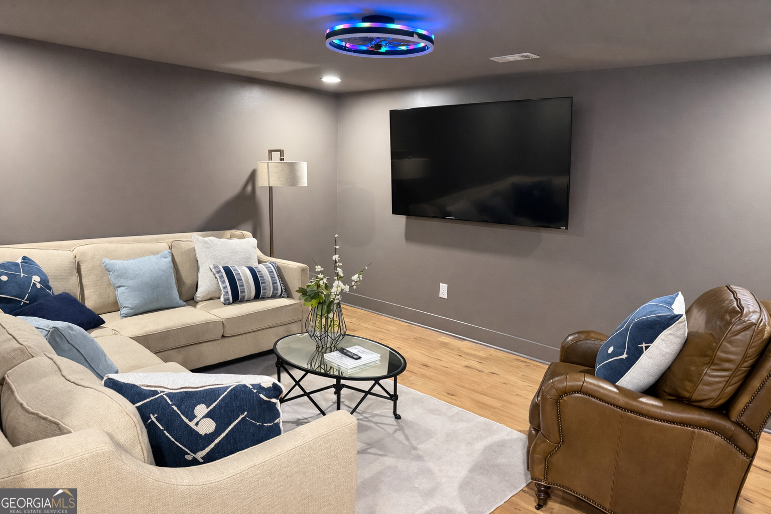 3045 Hitt Road Cumming, GA 30041 - Photo 41 of 46 a living room with furniture and a flat screen tv