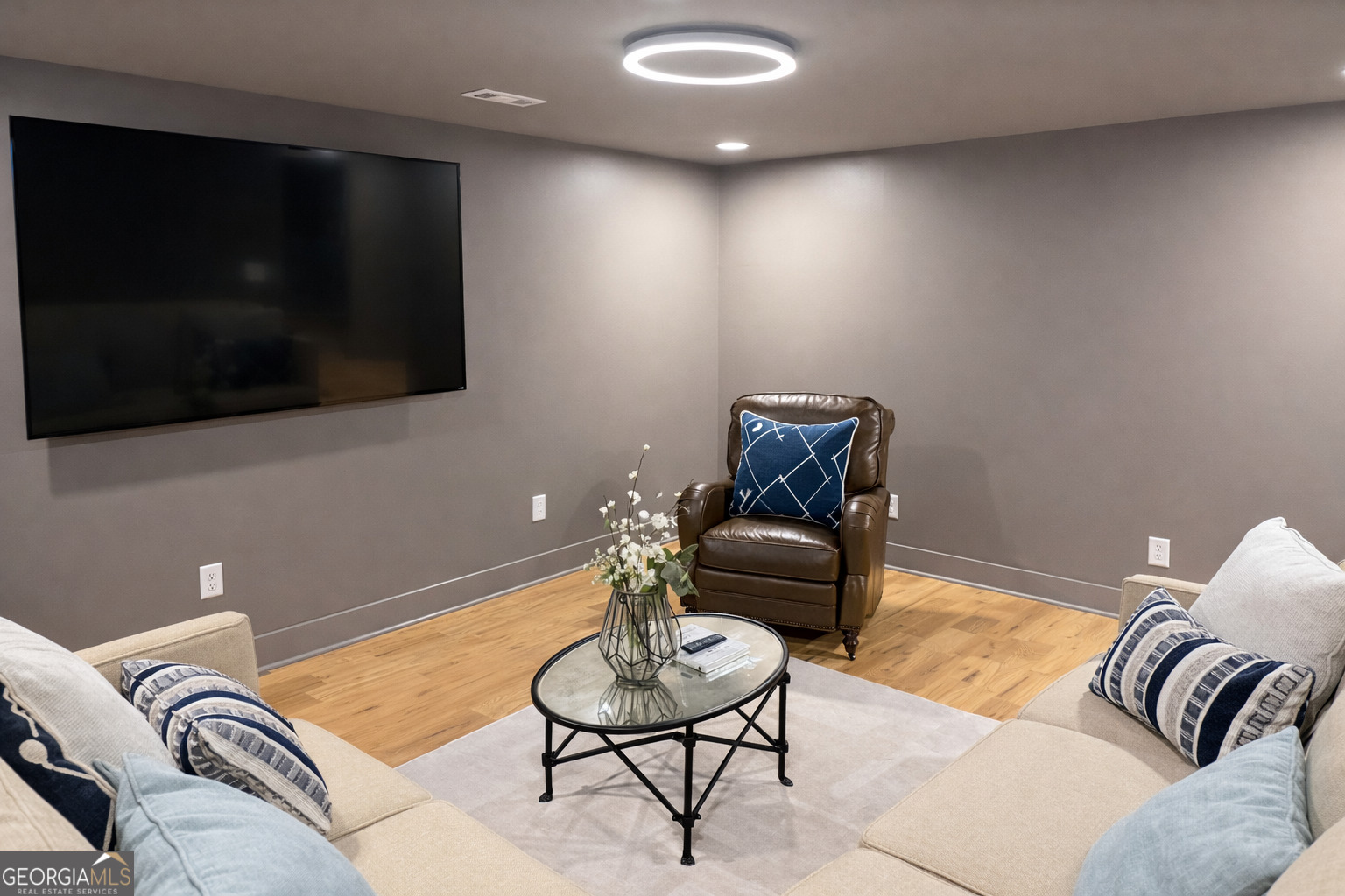 3045 Hitt Road Cumming, GA 30041 - Photo 42 of 46 a living room with furniture and a flat screen tv