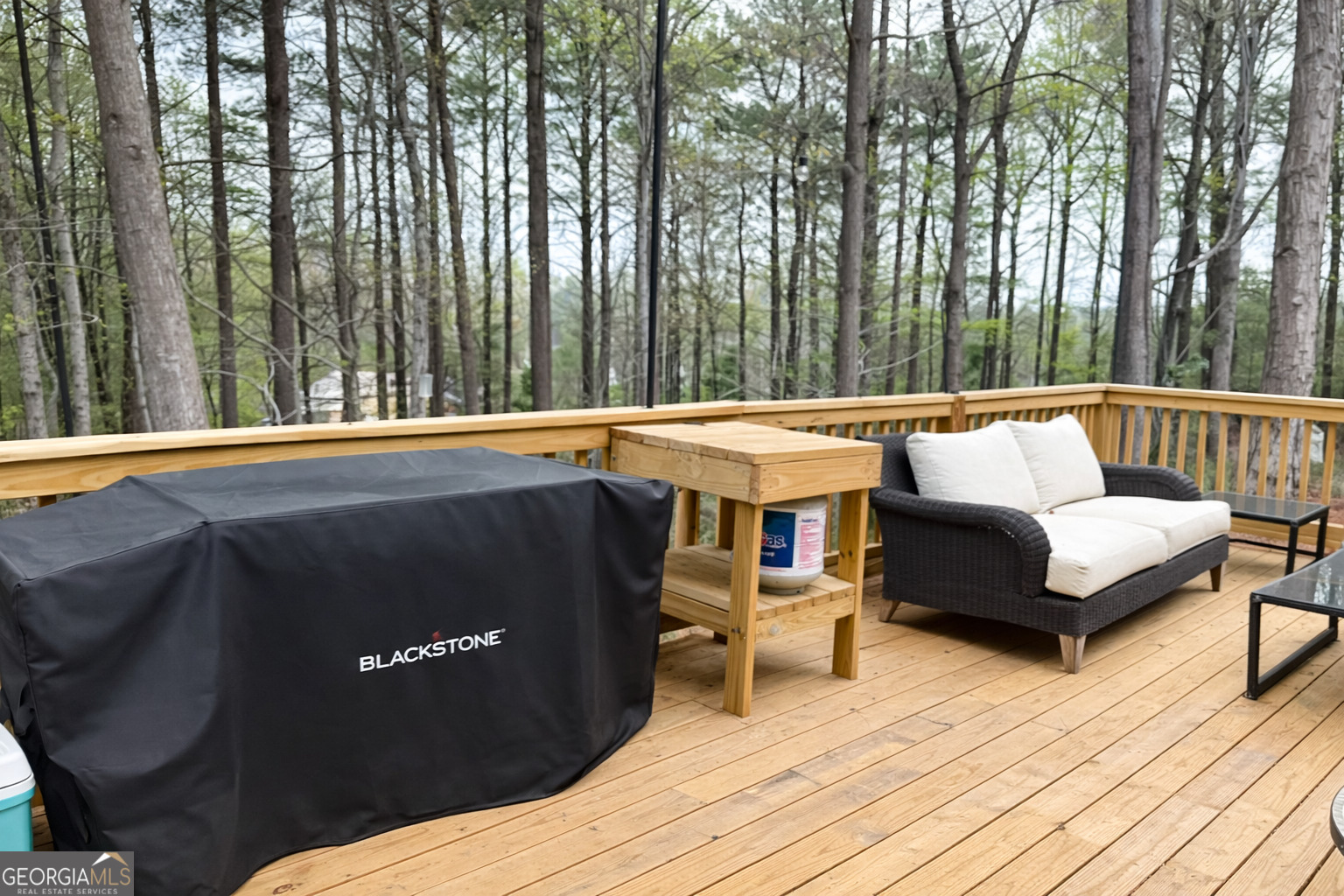 3045 Hitt Road Cumming, GA 30041 - Photo 44 of 46 a outdoor sitting area with furniture and wooden floor