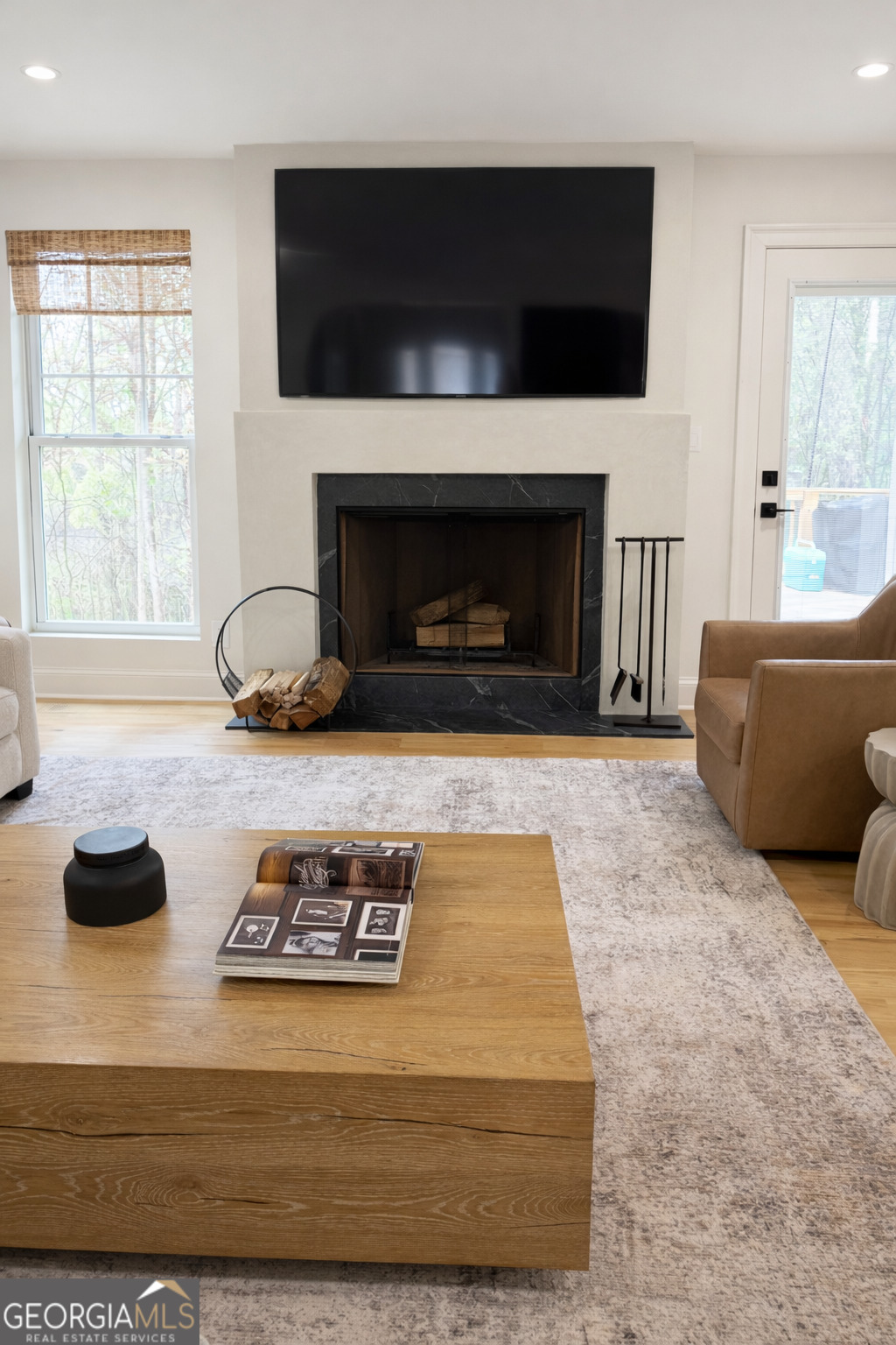 3045 Hitt Road Cumming, GA 30041 - Photo 8 of 46 a living room with furniture and a fireplace